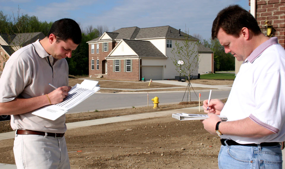 home inspectors working on their notes